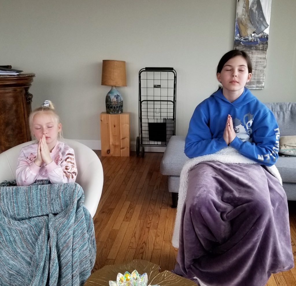 Two children receiving their attunement