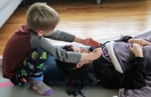 Children giving and receiving reiki.