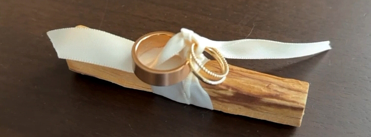 Ring wound around palo santo wood