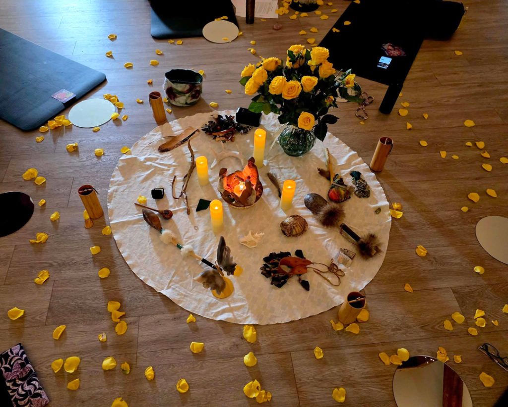 Healing circle with candles and flowers